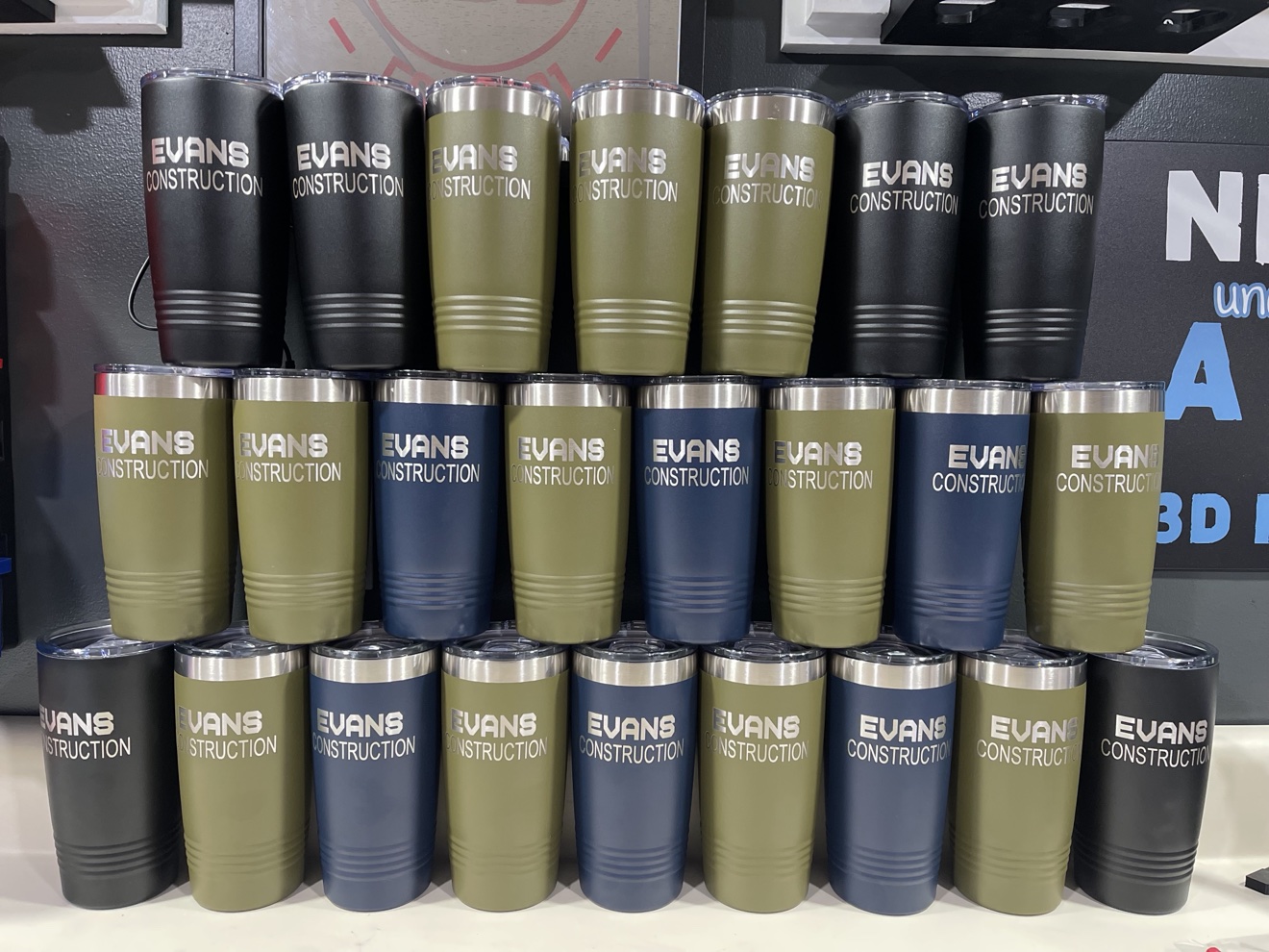 Stack of engraved tumblers for a local construction crew