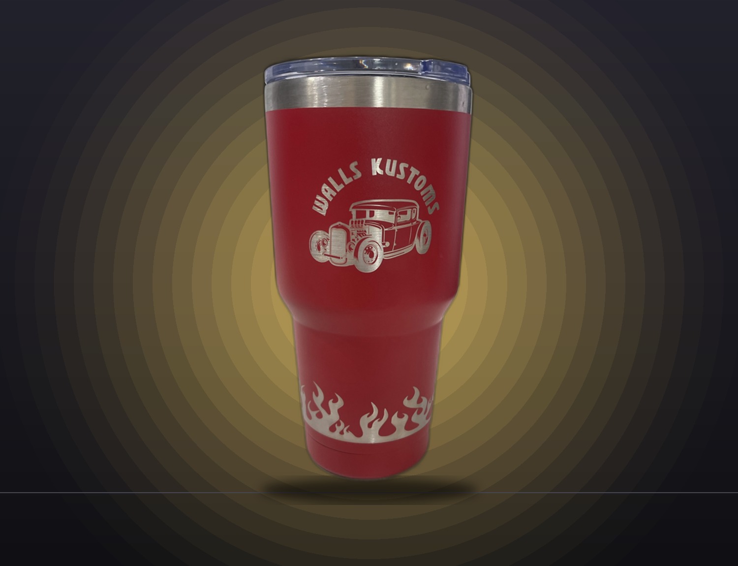Red engraved tumbler with a flaming hot rod design